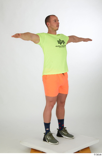 Joel dressed green sneakers orange shorts sports standing t-pose whole…